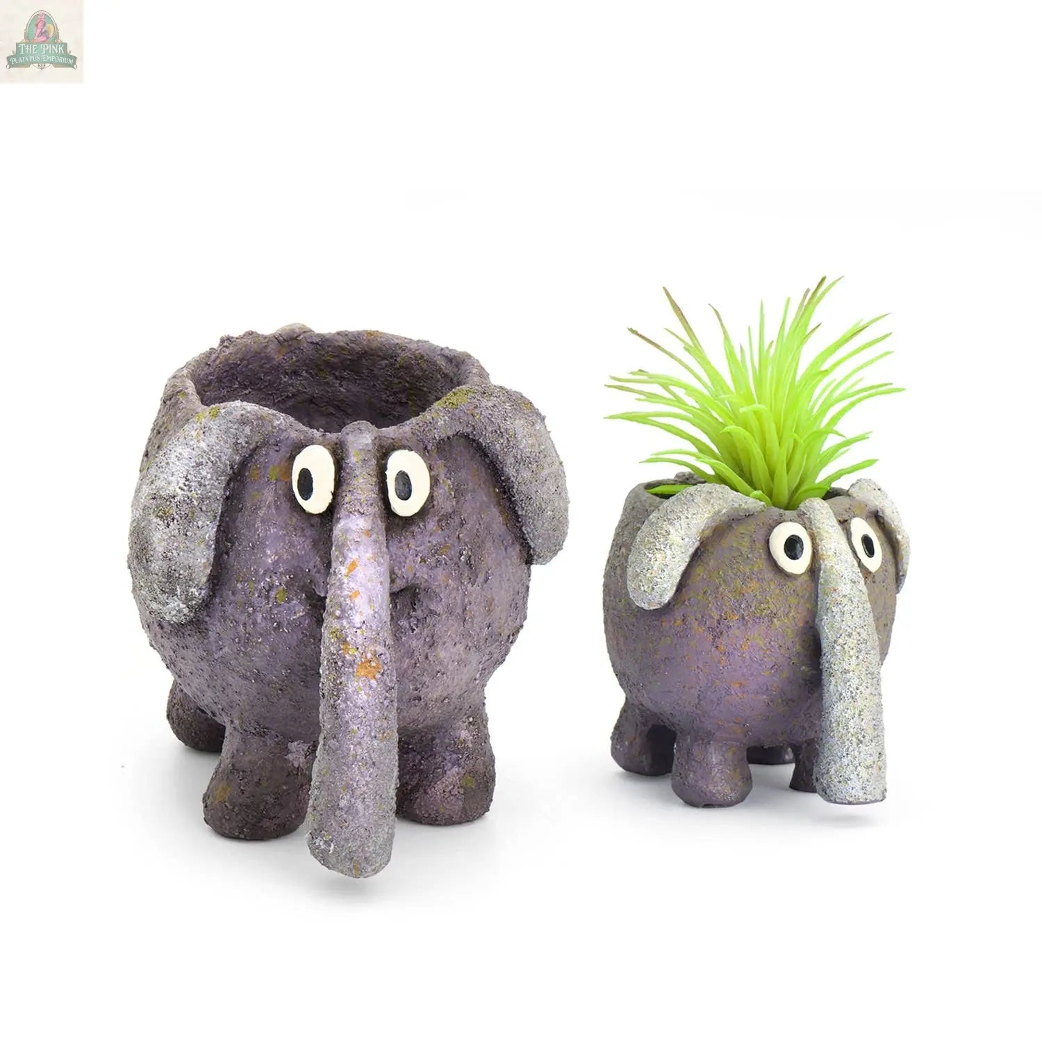 Add a touch of whimsy to your space with BoBo the Elephant Blobhouse Planter by Blob House Planters—these small, round, purple pots feature big eyes and long trunks, perfect for succulents or as playful plant decor.