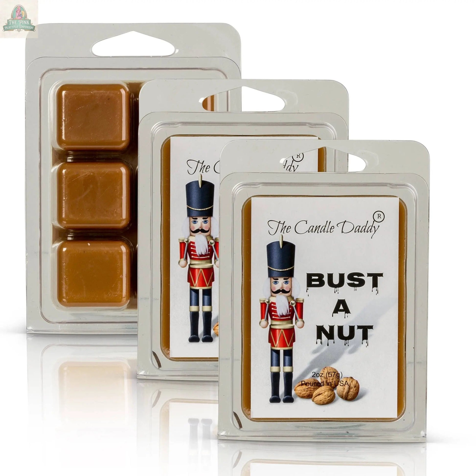 A Bust A Nut - Funny Christmas Banana Nut Bread Scented Wax Melts pack is shown, featuring a toy soldier and walnuts on the label, with caramel-colored melts visible inside the clear packaging.