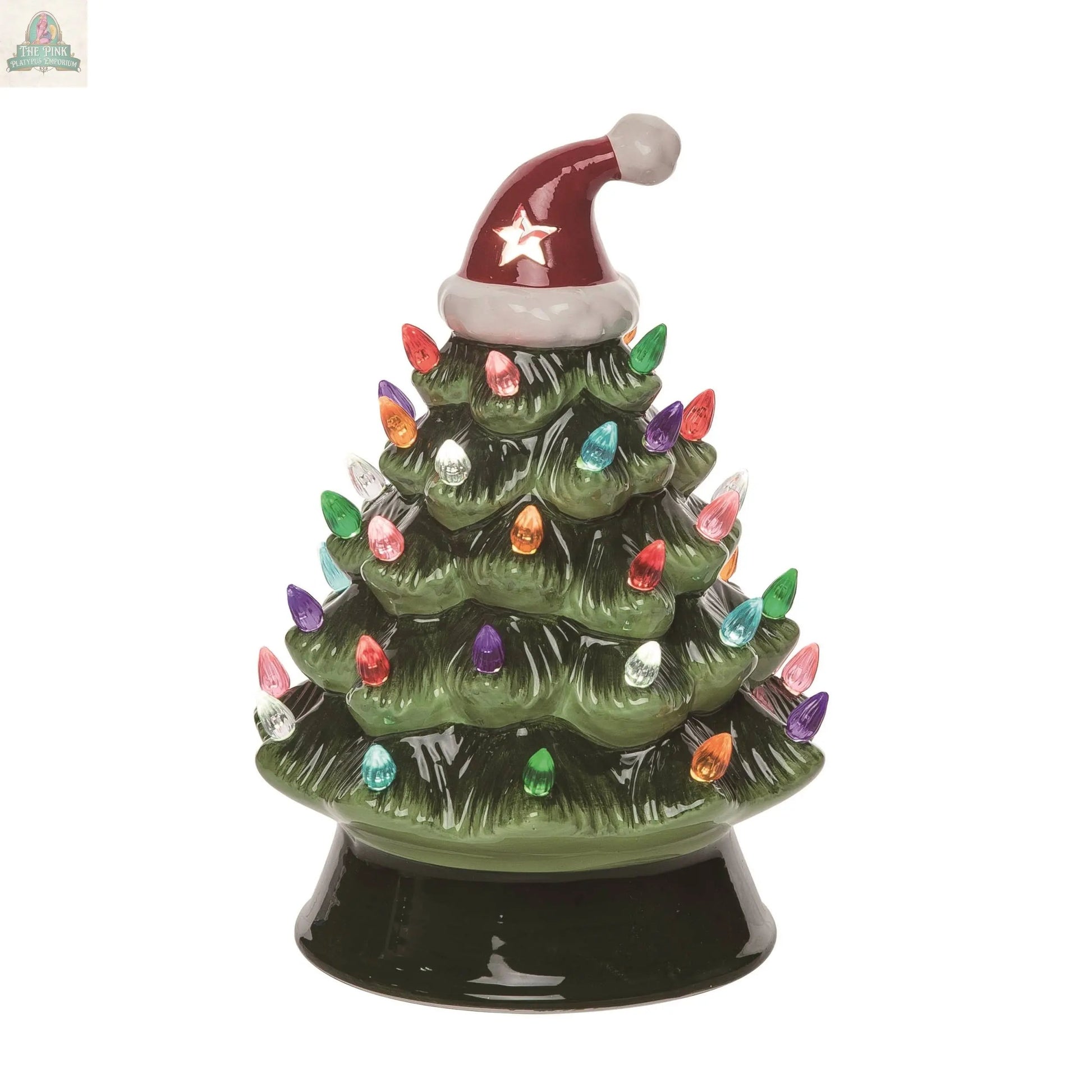 The 10.5 in. Christmas Retro Tree Santa Hat Decor features a ceramic Christmas tree on a glossy green base, topped with a red Santa hat and adorned with multicolored lights for festive charm.