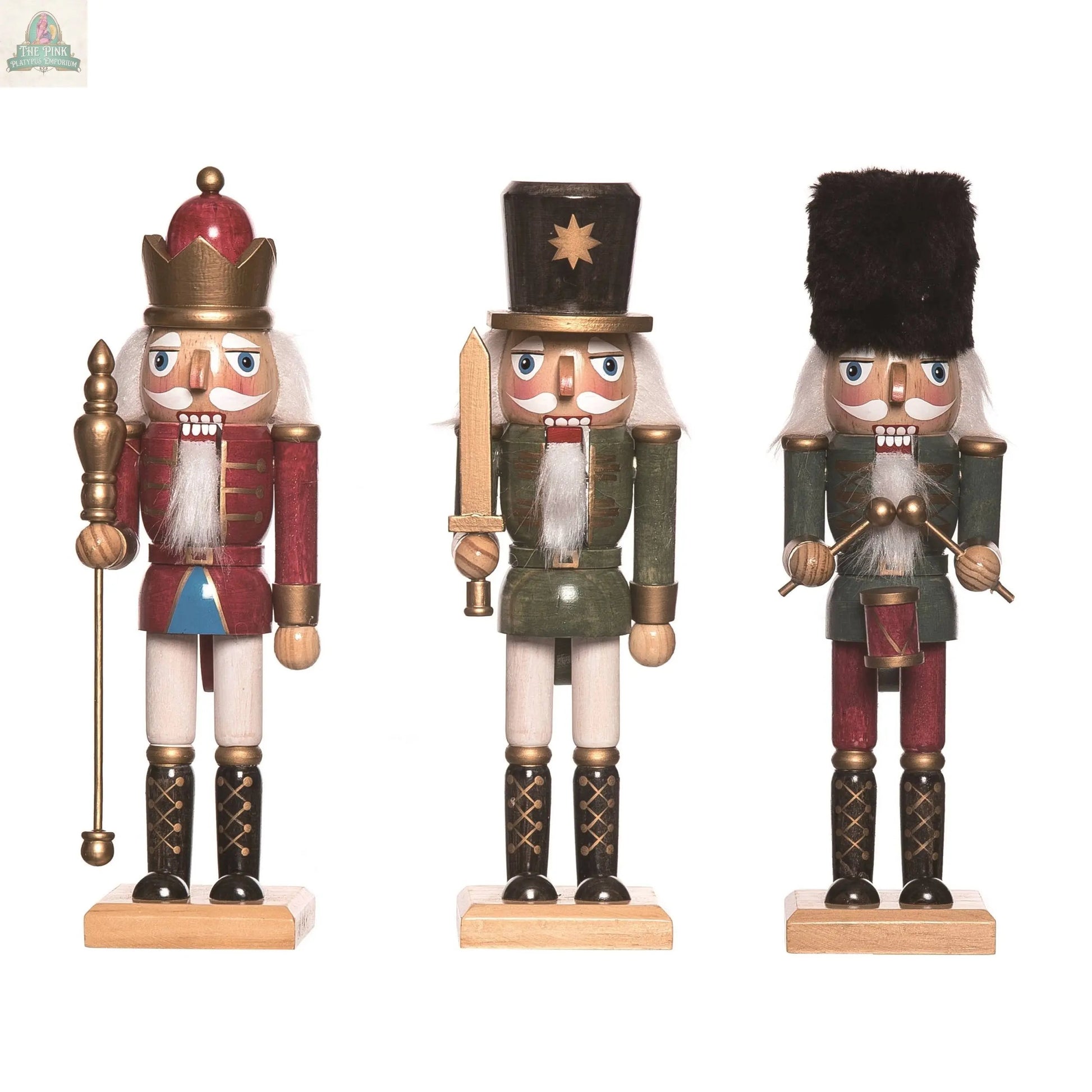 The Transpac Christmas Wood Regal Shining Nutcracker set of 3 features distinct, uniformed nutcrackers with white hair and beards—perfect as a charming holiday home decoration or festive gift.
