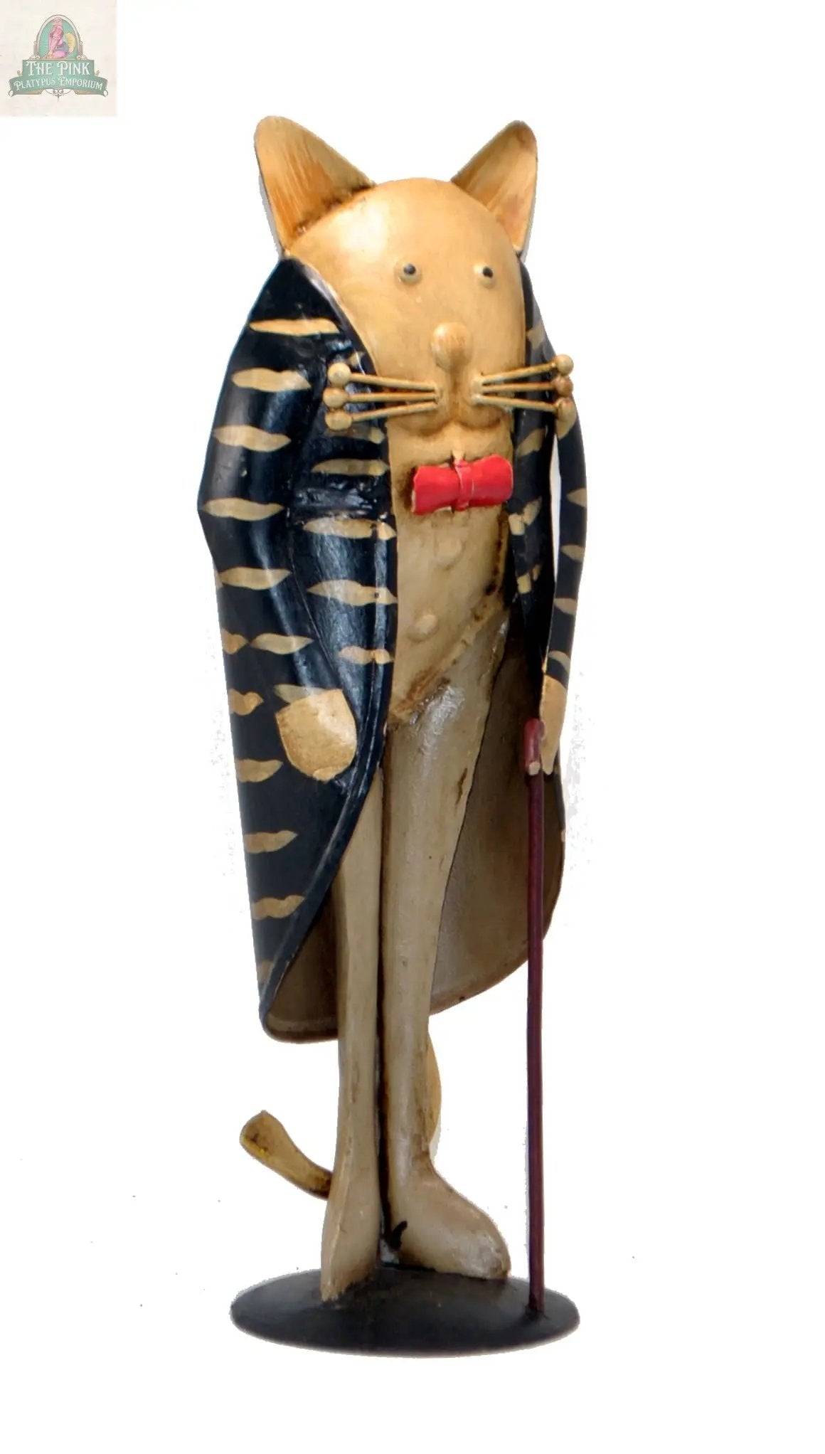 The Cat Figurine with walking stick—hand painted with a vintage look—features a whimsical, dapper design. This small decor piece adds playful charm to any space, making it perfect for farmhouse or eclectic interiors.