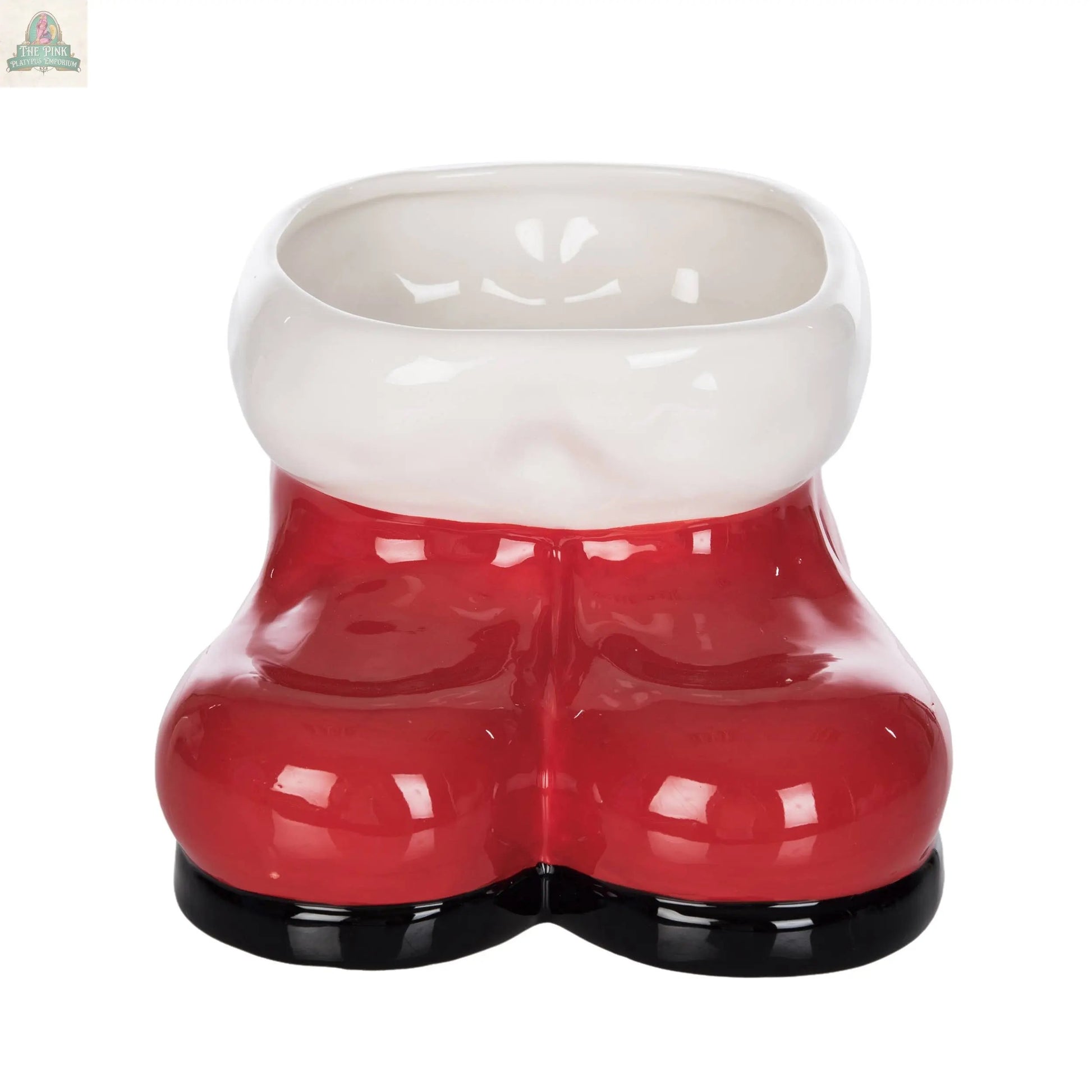 The Ceramic Santa Boots Festive Red Tabletop Decor features empty red ceramic boots with a white rim and black soles, viewed from the front—perfect for holiday decor.