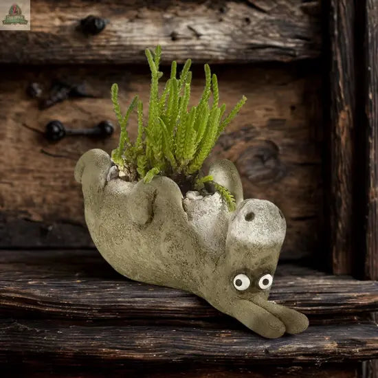 Chester, the Donkey Blobhouse Planter Laying by Pink Platypus Emporium is a whimsical poly-resin planter with googly eyes, perfect for displaying green plants and adding charm to your garden décor.