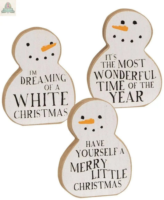 The Christmas Carol Chunky Snowman Sitter, 3 assorted, features wooden snowmen with carrot noses and festive sayings—ideal as farmhouse Christmas decor or charming wooden snowman decor for your holiday home.