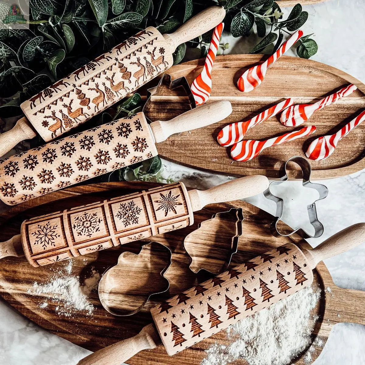 The Christmas Rolling Pin Set | 10 Styles adds festive charm to holiday baking, with cheerful patterns perfect for cookies on flour-dusted wooden boards, complemented by greenery and red-and-white candy cane treats.