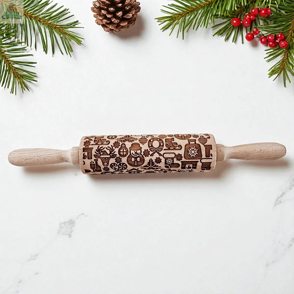 The Christmas Rolling Pin Set | 10 Styles rests on a white surface, surrounded by pine branches, red berries, and a pine cone—ideal for festive holiday baking.