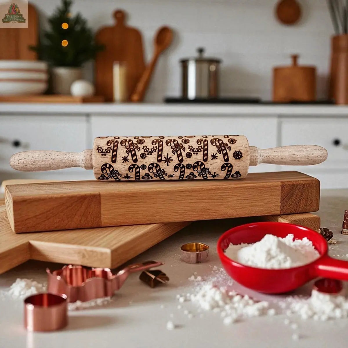 The Christmas Rolling Pin Set | 10 Styles features festive patterns, perfect for bakers—seen here on wooden boards beside red flour-filled measuring cups and metal cookie cutters, making a delightful holiday kitchen gift.