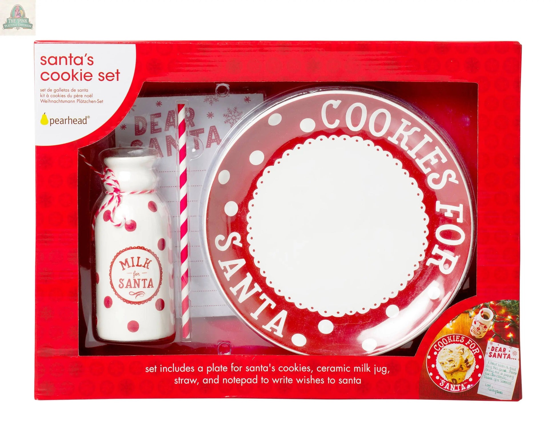 The Christmas Santa's Milk Jug, Plate and Dear Santa Notepad Set includes a plate labeled "Cookies for Santa," a ceramic milk jug, red-striped straw, and notepad for messages—all in a festive red box for Christmas Eve.