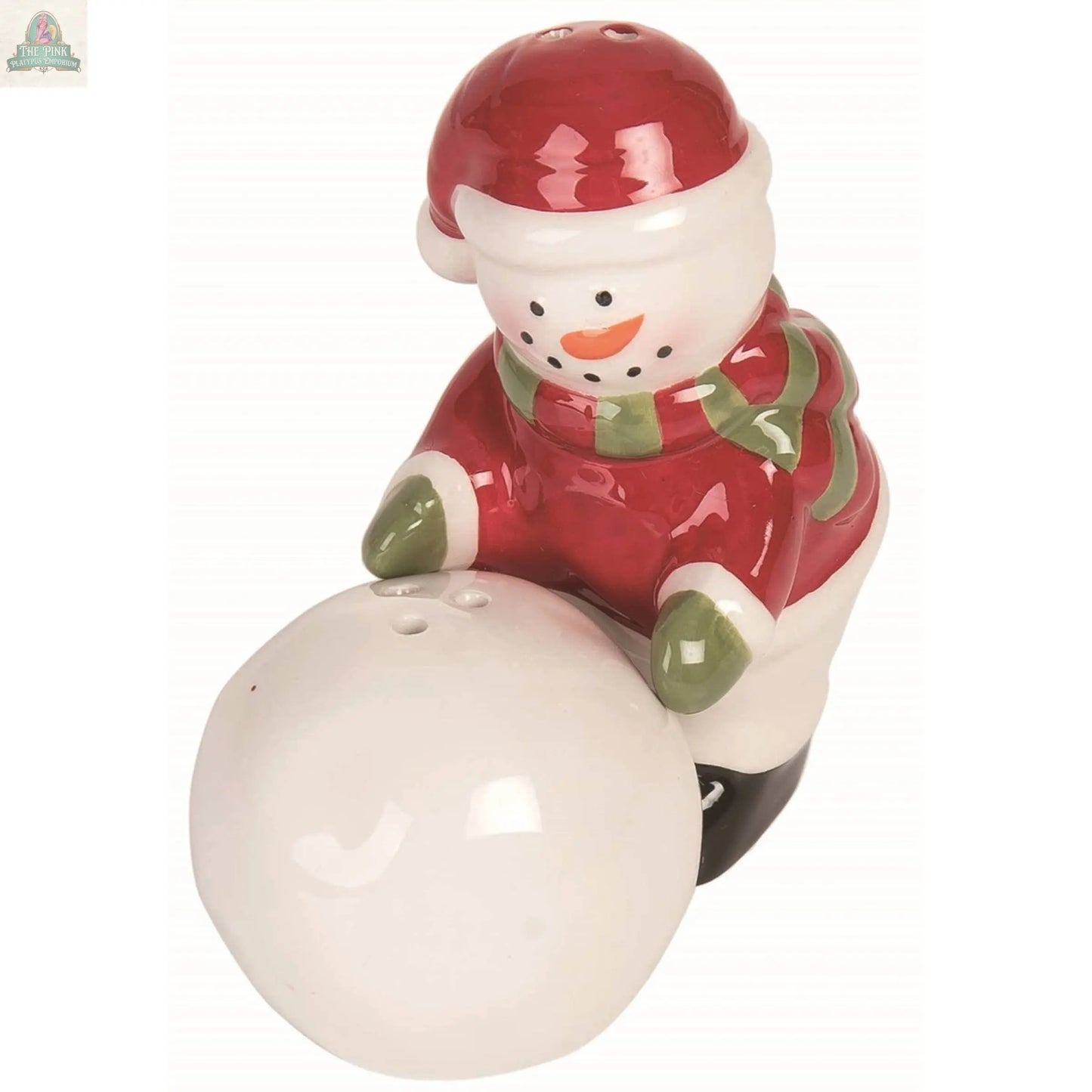 The Christmas Snowman Snowball Salt Pepper Shaker Set features a ceramic snowman in a red hat, coat, and green scarf, pushing a snowball. Charming and festive, this 2-piece set makes a perfect holiday gift or table decor.
