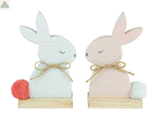 The Cottontail Bunny Tabletop 2 Assorted features one white and one pale pink handcrafted wooden bunny with twine bows and pom-pom tails on wooden bases—perfect for rustic spring décor or farmhouse Easter decorations.