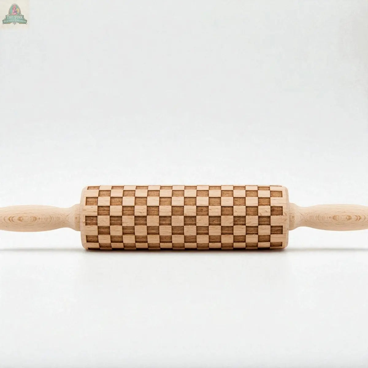 The Courtly Check Rolling Pin features an elegant checkered pattern engraved on its wooden roller, making it a stylish addition to your baking tool collection. Displayed against a plain white background.