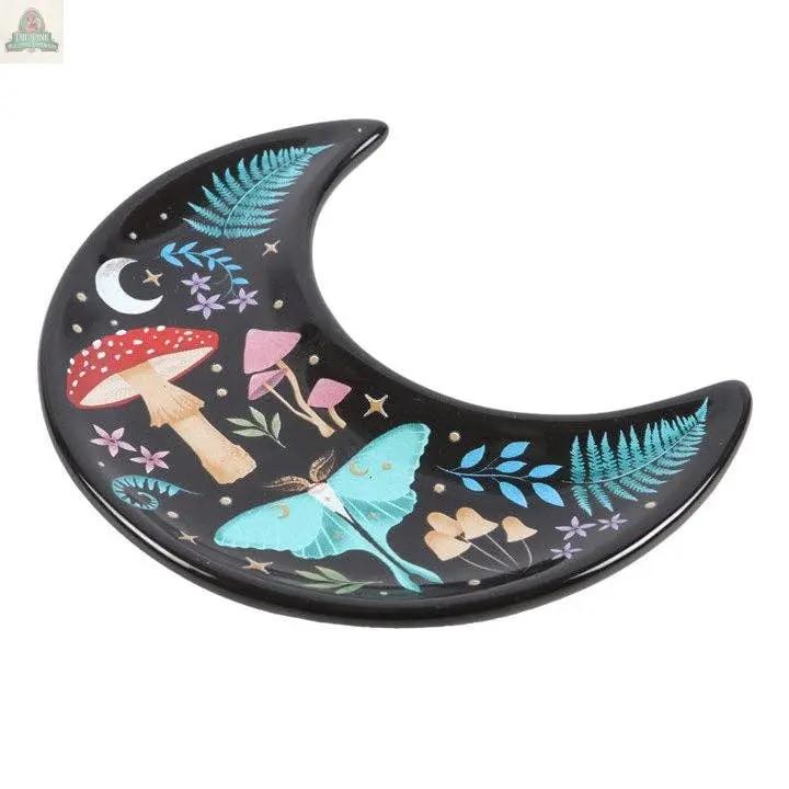 The Crescent Moon Dark Forest Print Trinket Dish is a whimsical jewellery holder, adorned with vibrant mushrooms, ferns, purple flowers, a moth, and a tiny white crescent moon—perfect celestial decor for your space.