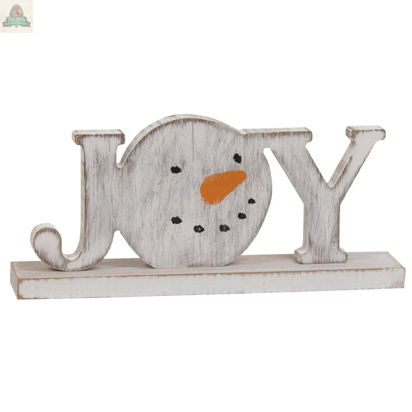 The Distressed Snowman "Joy" on Base is a winter farmhouse decor sign, featuring a snowman-shaped "O" with a carrot nose and dotted eyes and mouth.