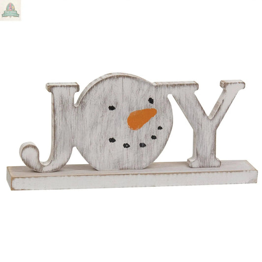 The Distressed Snowman "Joy" on Base is a winter farmhouse decor sign, featuring a snowman-shaped "O" with a carrot nose and dotted eyes and mouth.