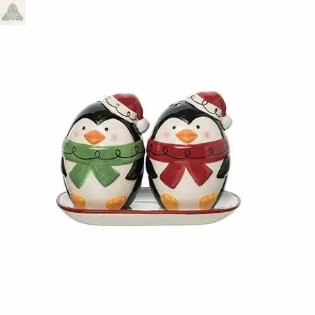 The Dolomite Jolly Penguins Salt & Pepper Shaker Set features two festive penguins in red and green scarves and Santa hats on a white tray—perfect for adding holiday cheer to your table decor.