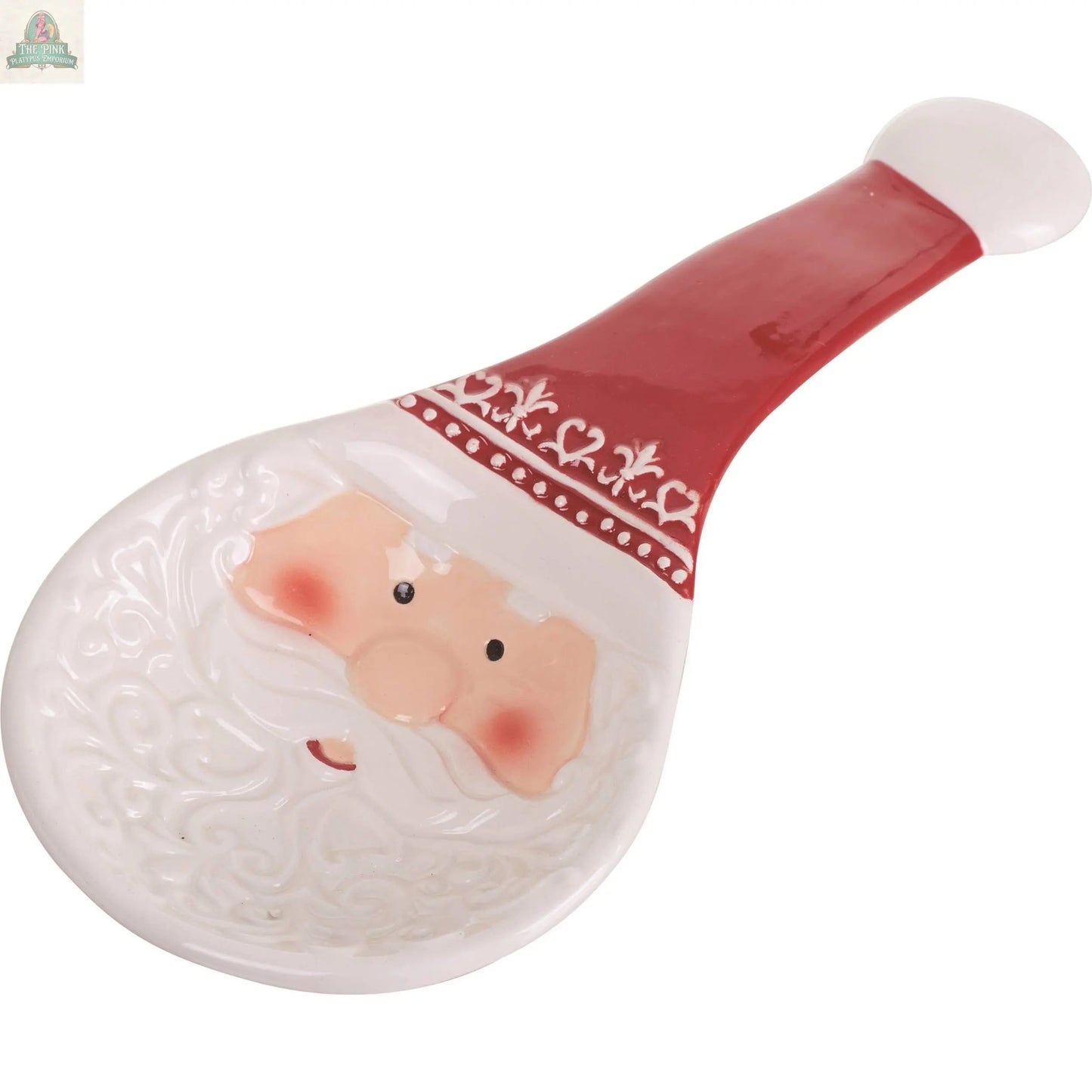 The Dolomite Santa Spoon Rest Festive Ceramic Tabletop Decor DS adds charm to your Christmas kitchen, shaped and painted like Santa’s face with a red hat handle—perfect for keeping utensils tidy and festive.