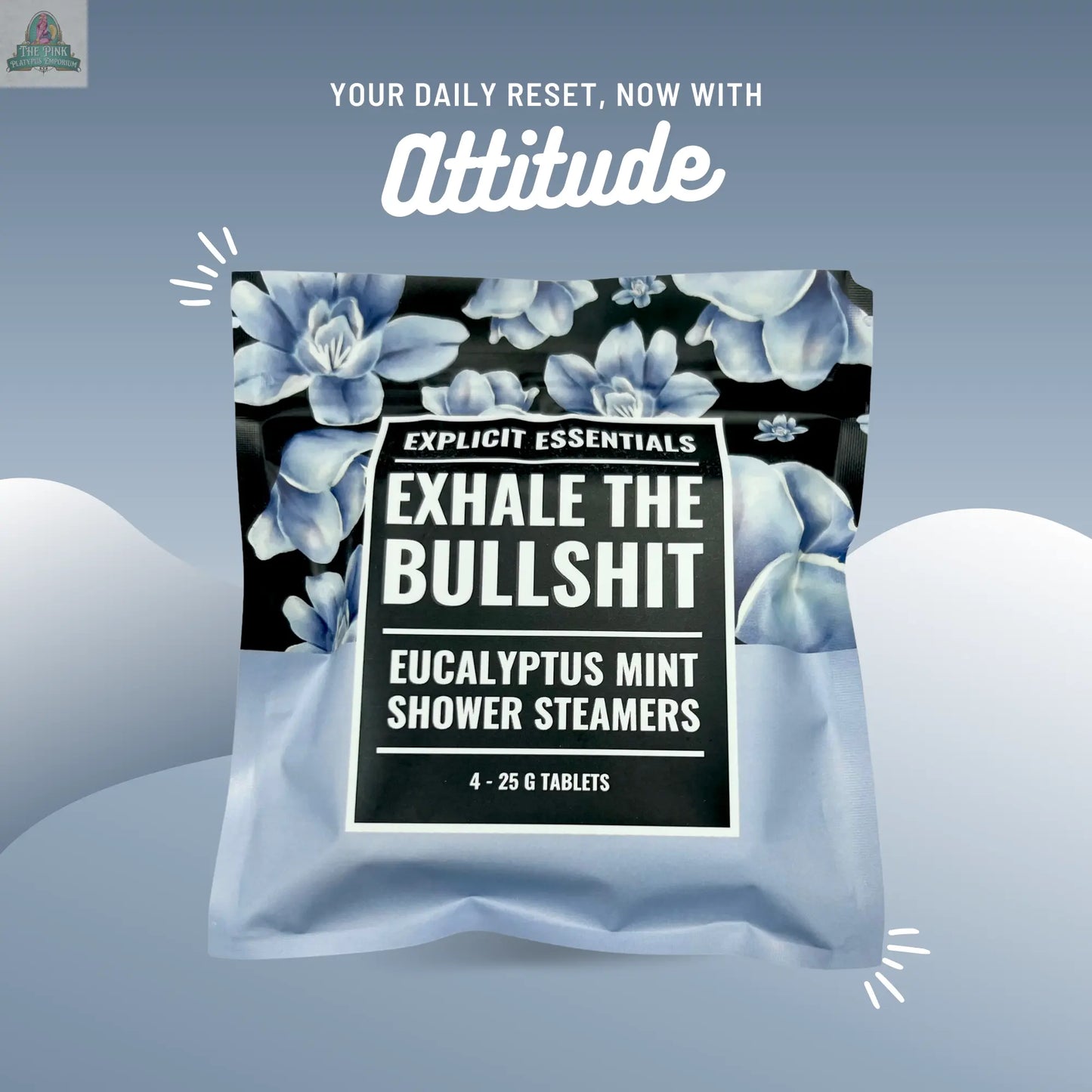 A pack of all-natural eucalyptus Exhale The Bullsh!t Shower Steamers by Explicit Essentials, featuring a blue floral design, sits on a light blue background. Above is the text: "Your daily reset, now with Attitude.