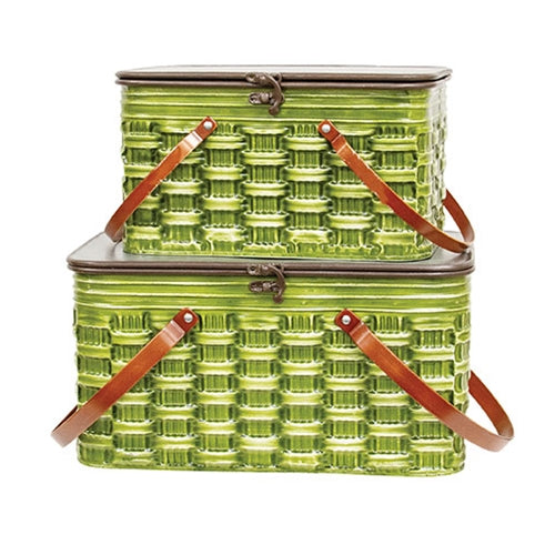 Green metal picnic baskets with brown straps on a white background
