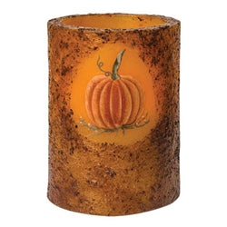 Decorative battery operated candle with a pumpkin design on a white background