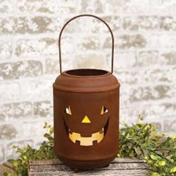 Decorative Halloween lantern with a jack-o'-lantern face on a wooden surface with a rustic background.
