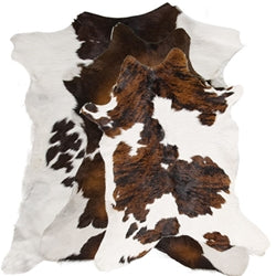 genuine calf hide rug in brown and white pattern, real cowhide rug for western and rustic home decor, natural hide with unique shape for floor or layering