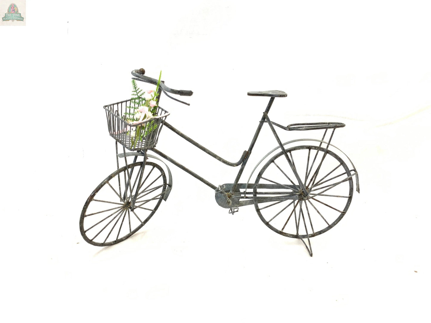 The HANDMADE LARGE GRAY ZINC WIRE BICYCLE WITH BASKET features vintage metal craftsmanship, filled with artificial white flowers and greenery—ideal for rustic home decor—and is shown against a plain white background.