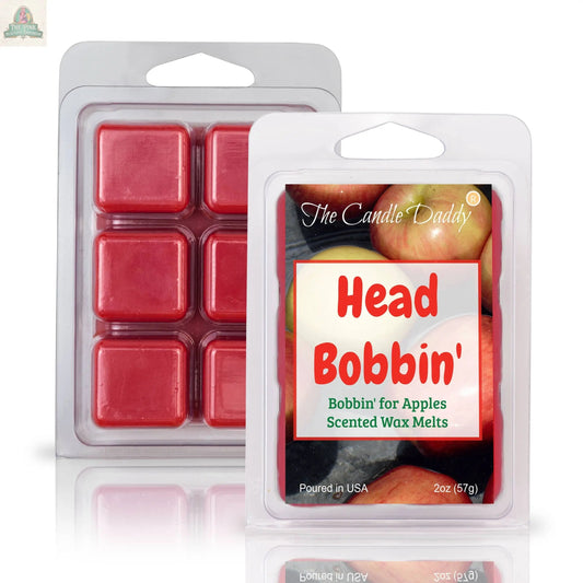 Two packages of red wax melts, one displaying six cubes and the other labeled "HEAD BOBBIN' - BOBBIN' FOR APPLES SCENTED WAX MELT," perfect for aromatherapy with a delicious apple scent shown on the packaging.