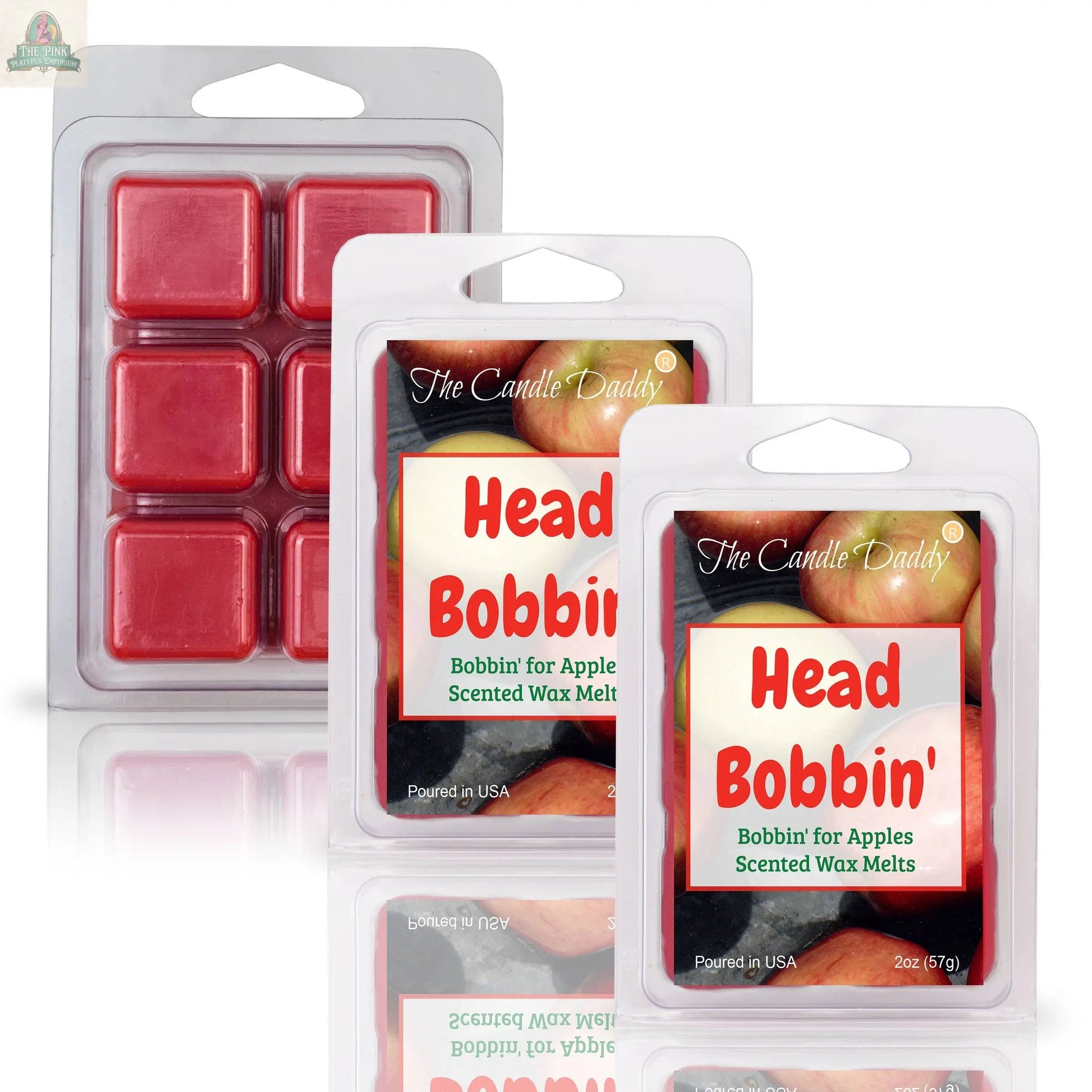 Three HEAD BOBBIN' - BOBBIN' FOR APPLES SCENTED WAX MELT packages by The Candle Daddy shown: two in clamshells and one with six red wax cubes, all labeled with apples for a fruity aromatherapy experience.
