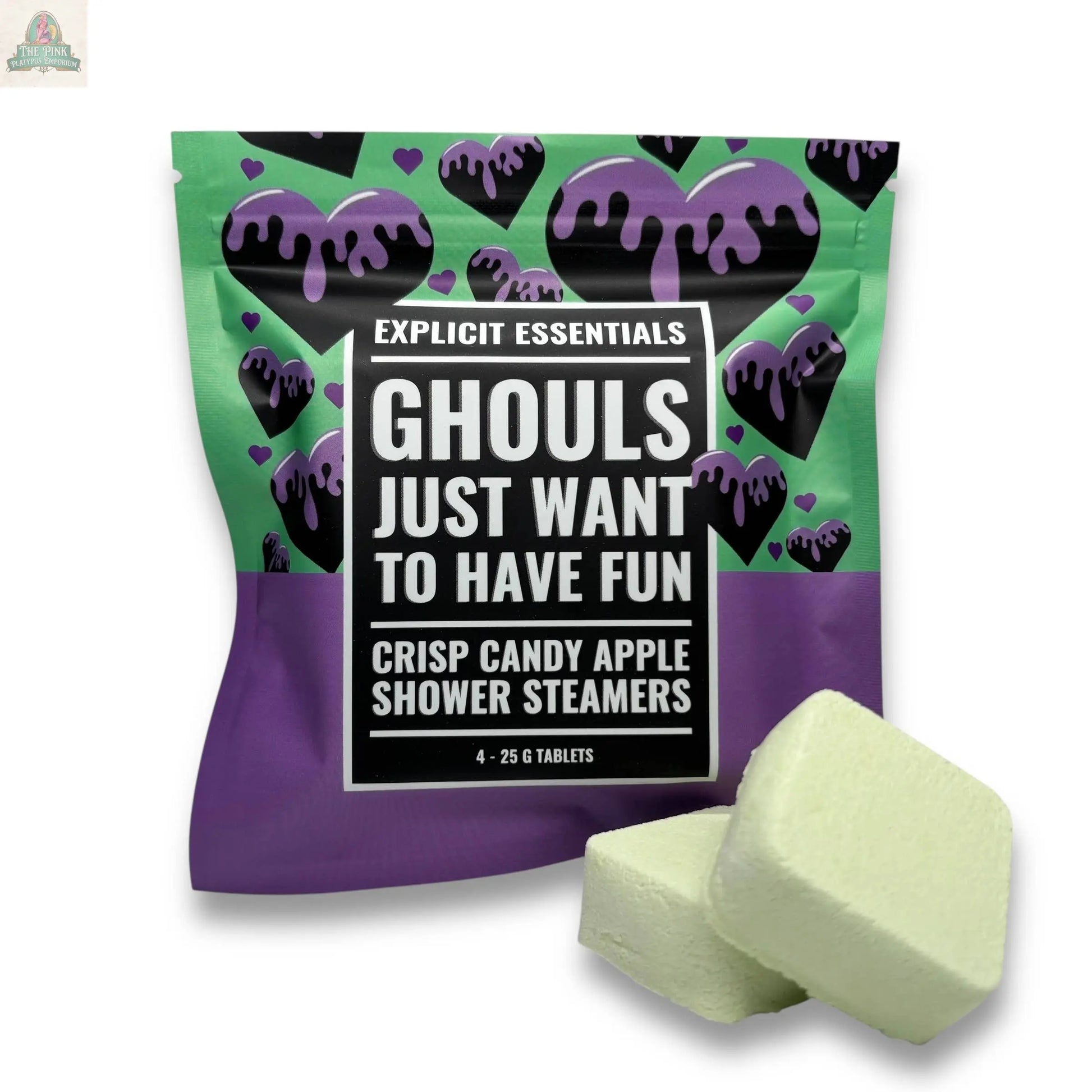 Explicit Essentials’ Halloween Shower Steamers | Spooky Season Gift comes in a colorful “Ghouls Just Want To Have Fun” package, featuring black hearts with purple drips on a green and purple background, plus two light green shower steamer tablets.