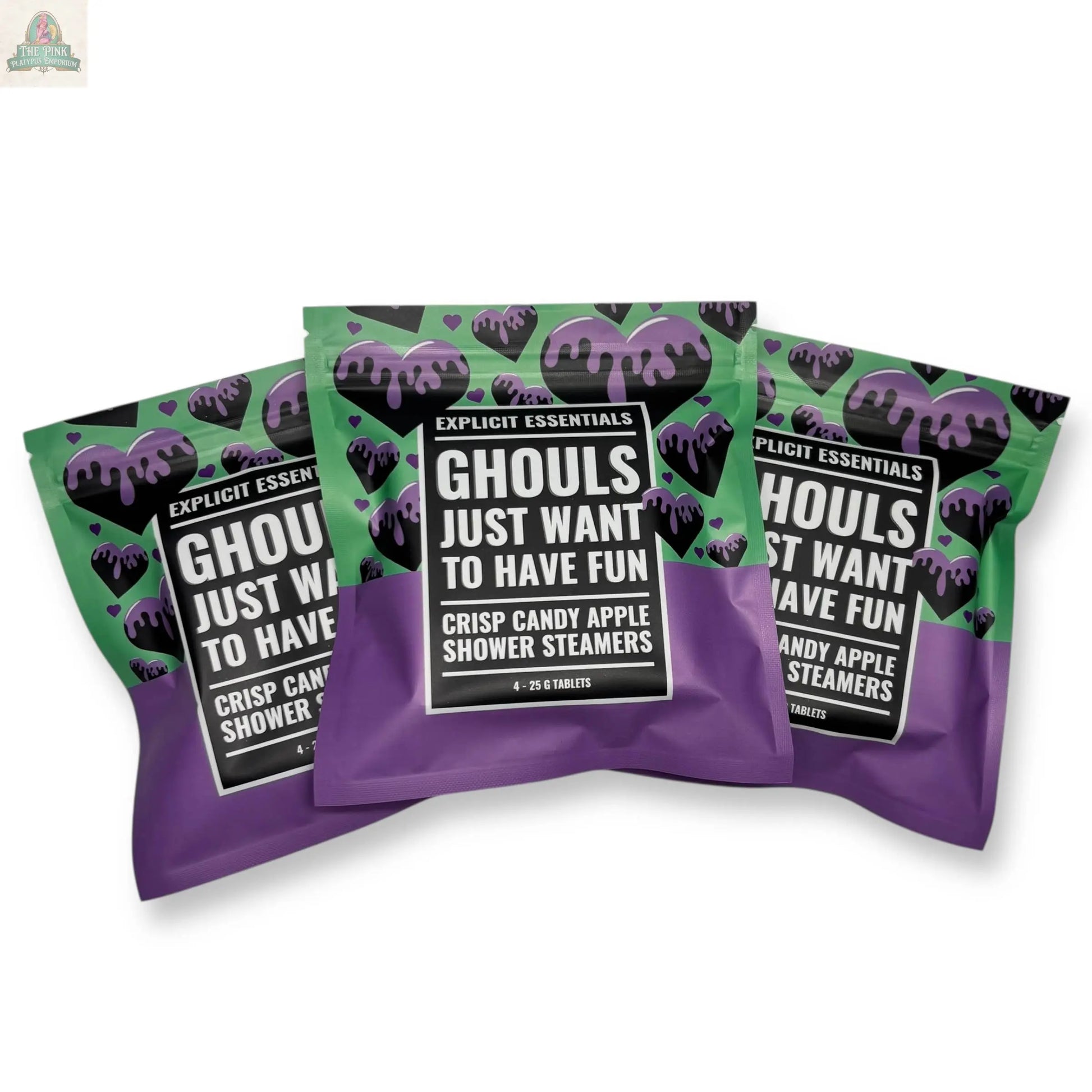 Three purple and green Halloween Shower Steamers from Explicit Essentials, labeled "Ghouls Just Want to Have Fun," feature playful candy apple designs—perfect as a Spooky Season Self-Care Gift.