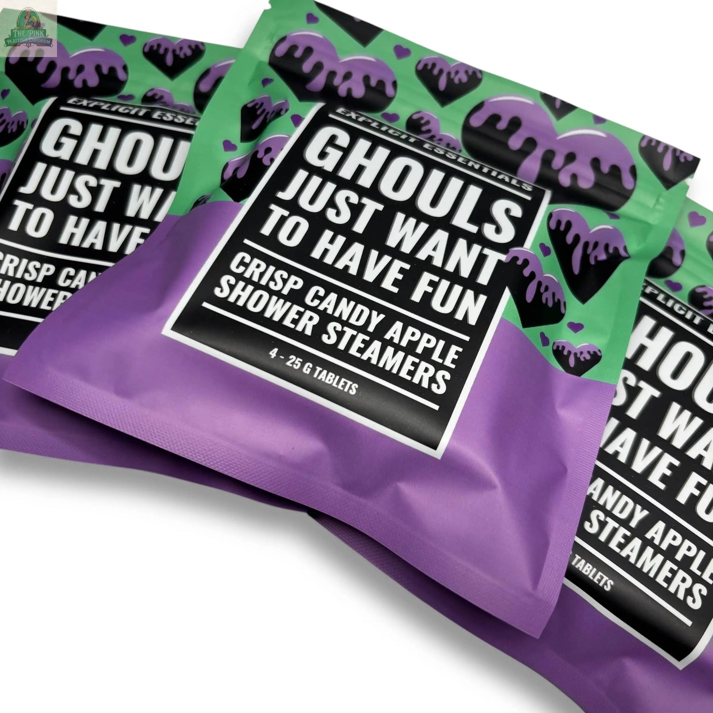 Three purple and green pouches of Explicit Essentials' Halloween Shower Steamers | Spooky Season Gift are displayed, featuring dripping black patterns and bold white text—an ideal Halloween self-care treat.