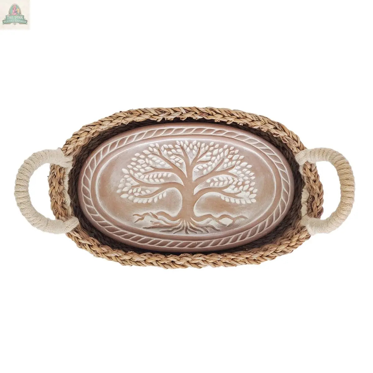 The KORISSA Handmade Bread Warmer & Wicker Basket - Tree of Life Oval features a wicker basket with rope handles and a terracotta warming stone embossed with a stylized tree at the center.