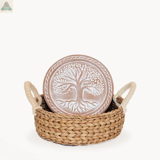 The KORISSA Handmade Bread Warmer & Wicker Basket - Tree of Life Round features a ceramic bread warmer with a raised tree design in a wicker basket with two handles, displayed against a plain white background.