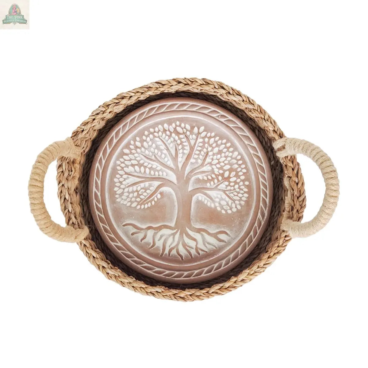 The KORISSA Handmade Bread Warmer & Wicker Basket - Tree of Life Round features a woven tray with rope handles and a decorative plate displaying a white tree on brown, ideal as a bread warmer or charming centerpiece.