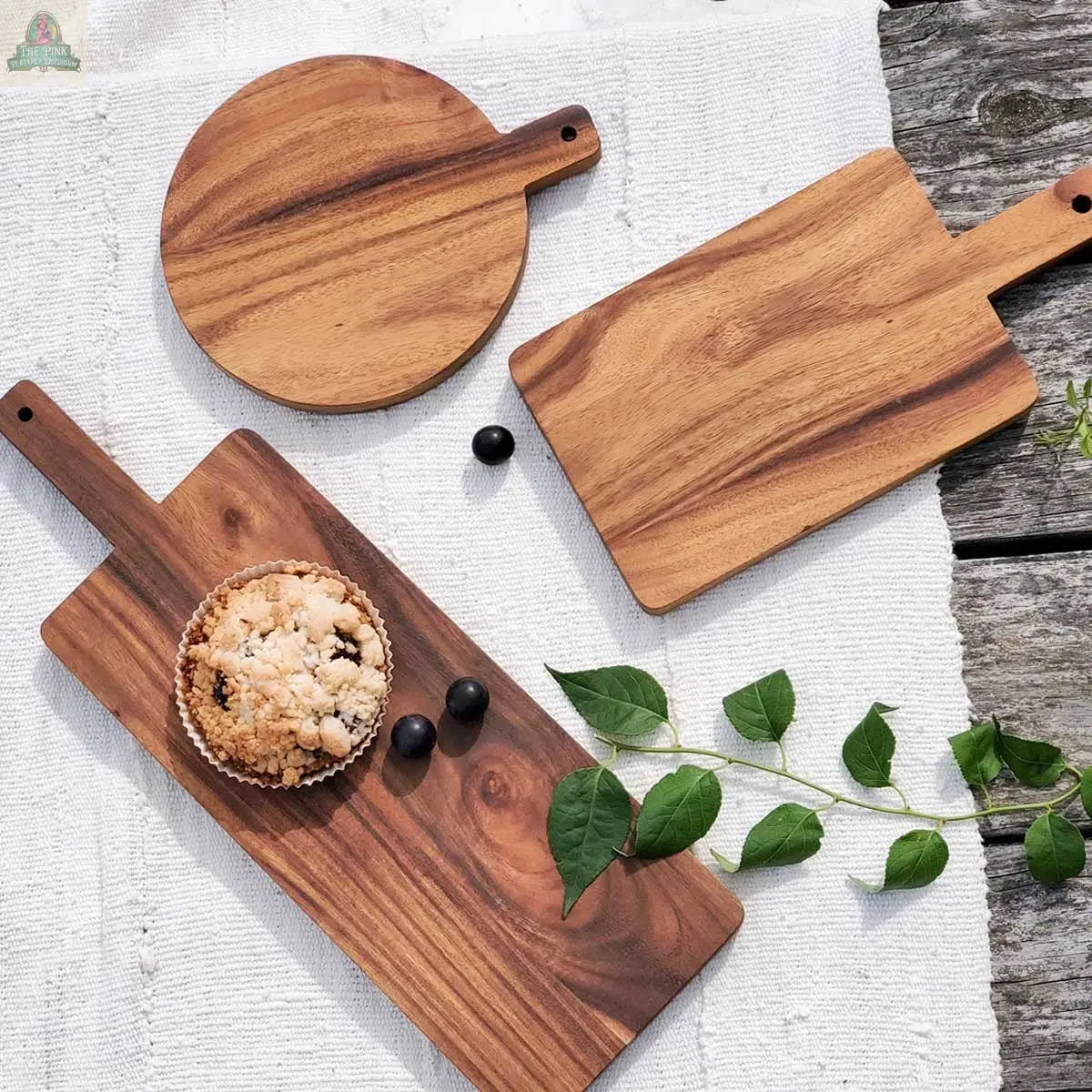 The KORISSA Handmade Wooden Serving Board - Large is an elegant Albizia wood board, perfect for stylish food prep or serving.