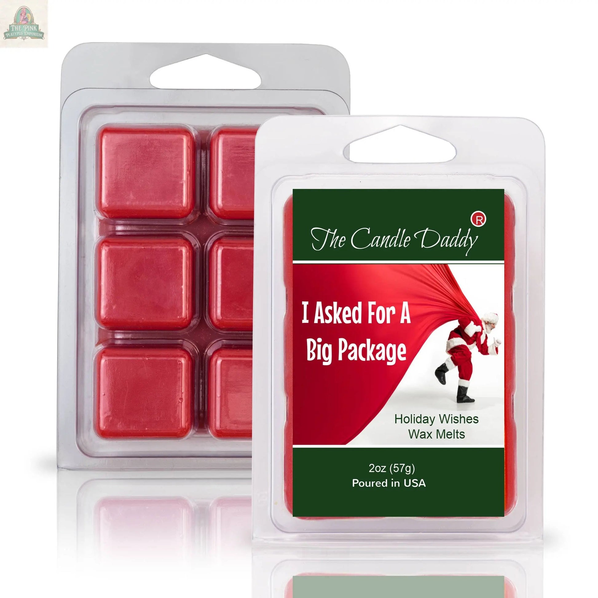 Two clamshell packs of I ASKED FOR A BIG PACKAGE - HOLIDAY WISHES SCENTED WAX MELTS are shown, with festive packaging featuring Santa and his red sack—perfect for gifting this holiday season.