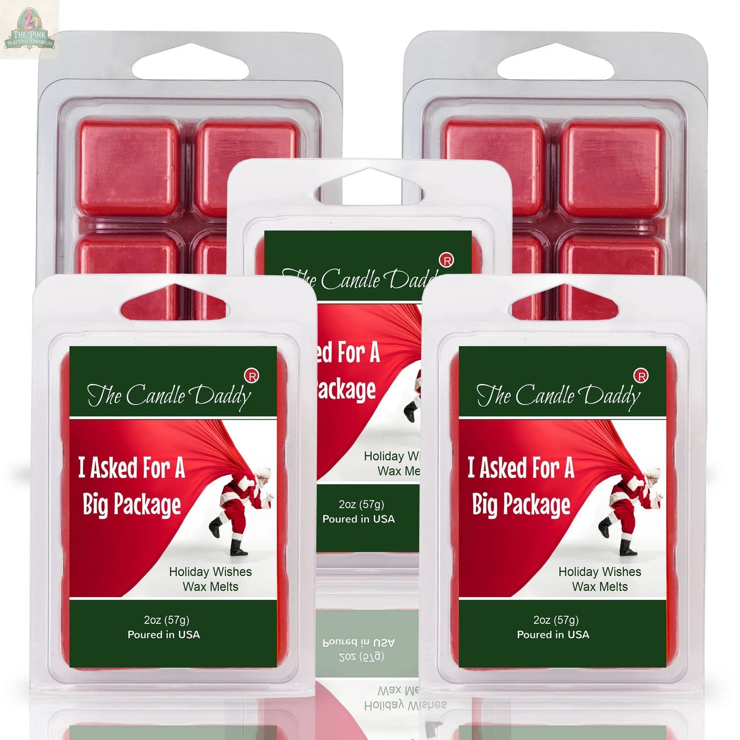 Five packs of I ASKED FOR A BIG PACKAGE - HOLIDAY WISHES SCENTED WAX MELTS, featuring festive packaging with Santa pulling back a red curtain—ideal for holiday aromatherapy.