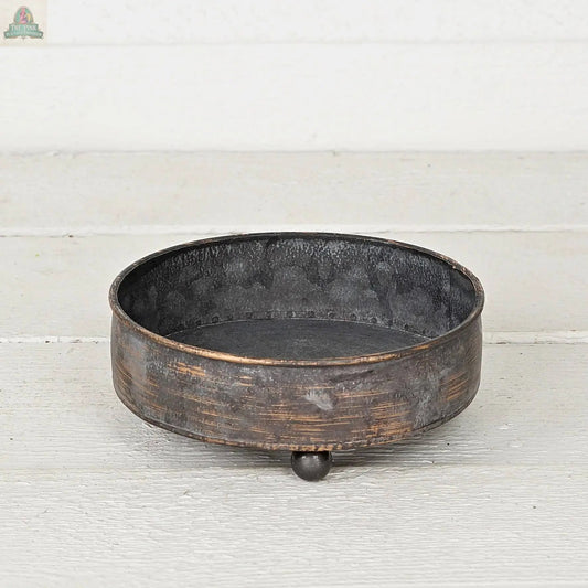 The Antique Pewter metal round Bowl container (6.5inD) by Impressive Enterprises, Inc. features a rustic, weathered finish and three ball feet—ideal as a decorative centerpiece for your table decor.