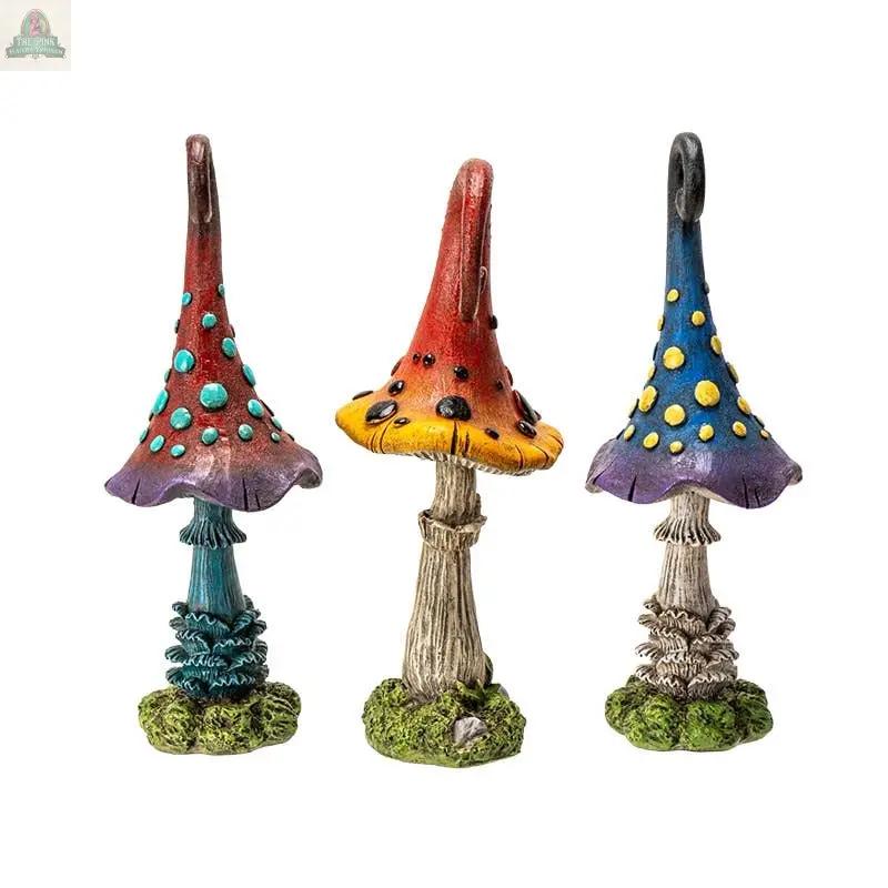 Add charm to your space with Magic Toadstool Mushrooms Home and Garden Decor—three vibrant mushroom statues, each featuring unique patterns and textured stems, perfect for whimsical garden or indoor displays.