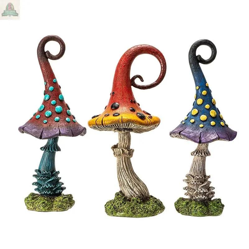 Add cottagecore charm to your space with the Magic Toadstool Mushrooms Home and Garden Decor—three whimsical, colorful statues featuring twisted stems, dotted caps, and textured green bases to brighten any garden or home.