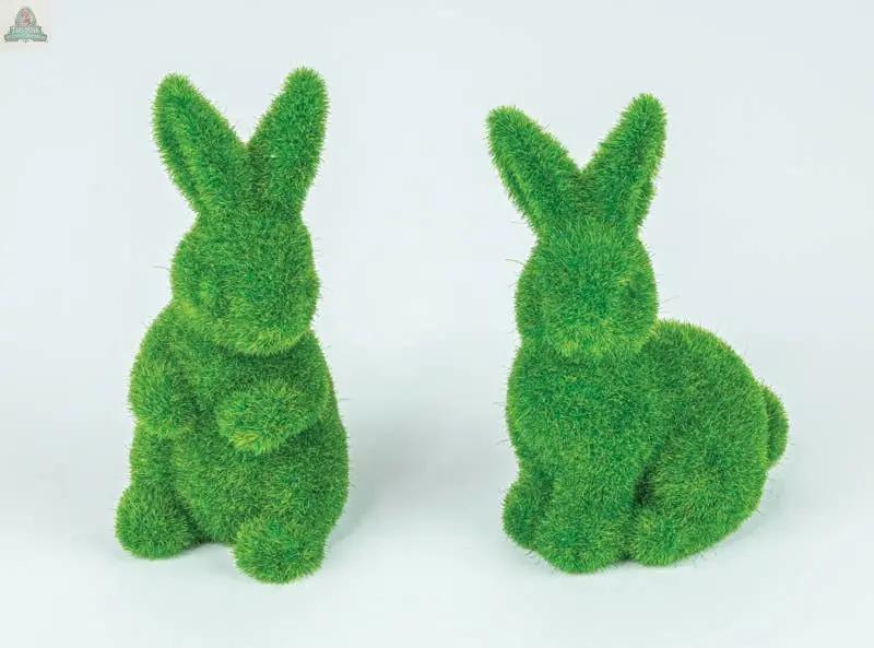 The Mossy Finish Bunbun 2 Ast features two artificial bunny figurines with a vivid grass-like texture, displayed on a plain white background—one sitting upright and the other gently crouching, facing slightly away.