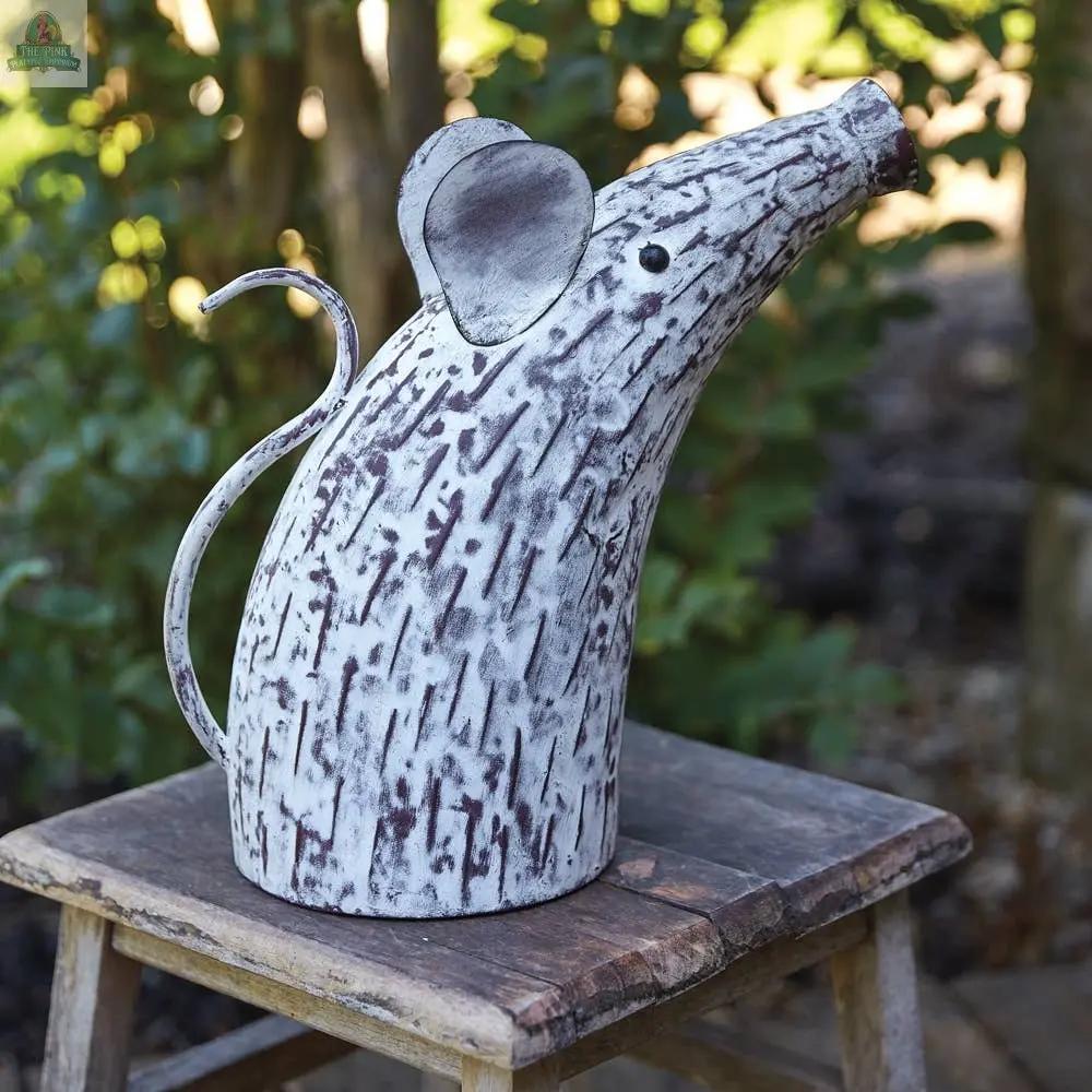 The Mouse Watering Can features a weathered white and gray finish, curved tail handle, and pointy nose spout—perfect for adding charm to your indoor plant watering routine.