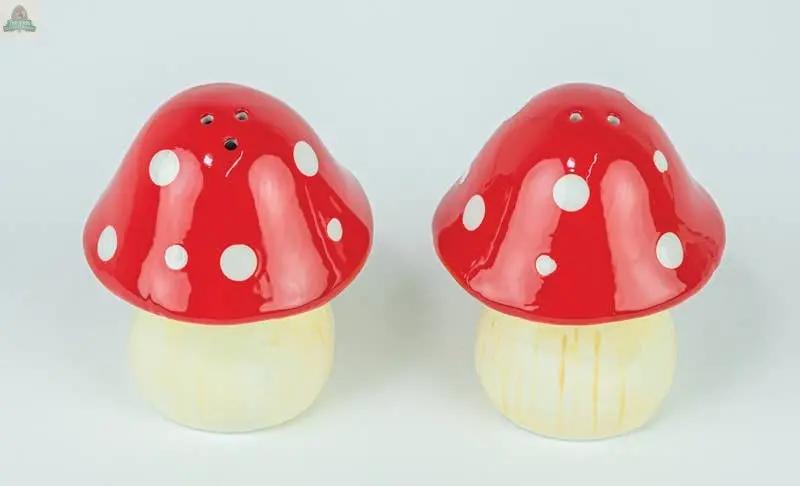 The Mushroom S&P Set features two ceramic shakers shaped like mushrooms with red caps and white spots, each measuring 4.96x2.48x3.15 inches, displayed side by side on a white background.