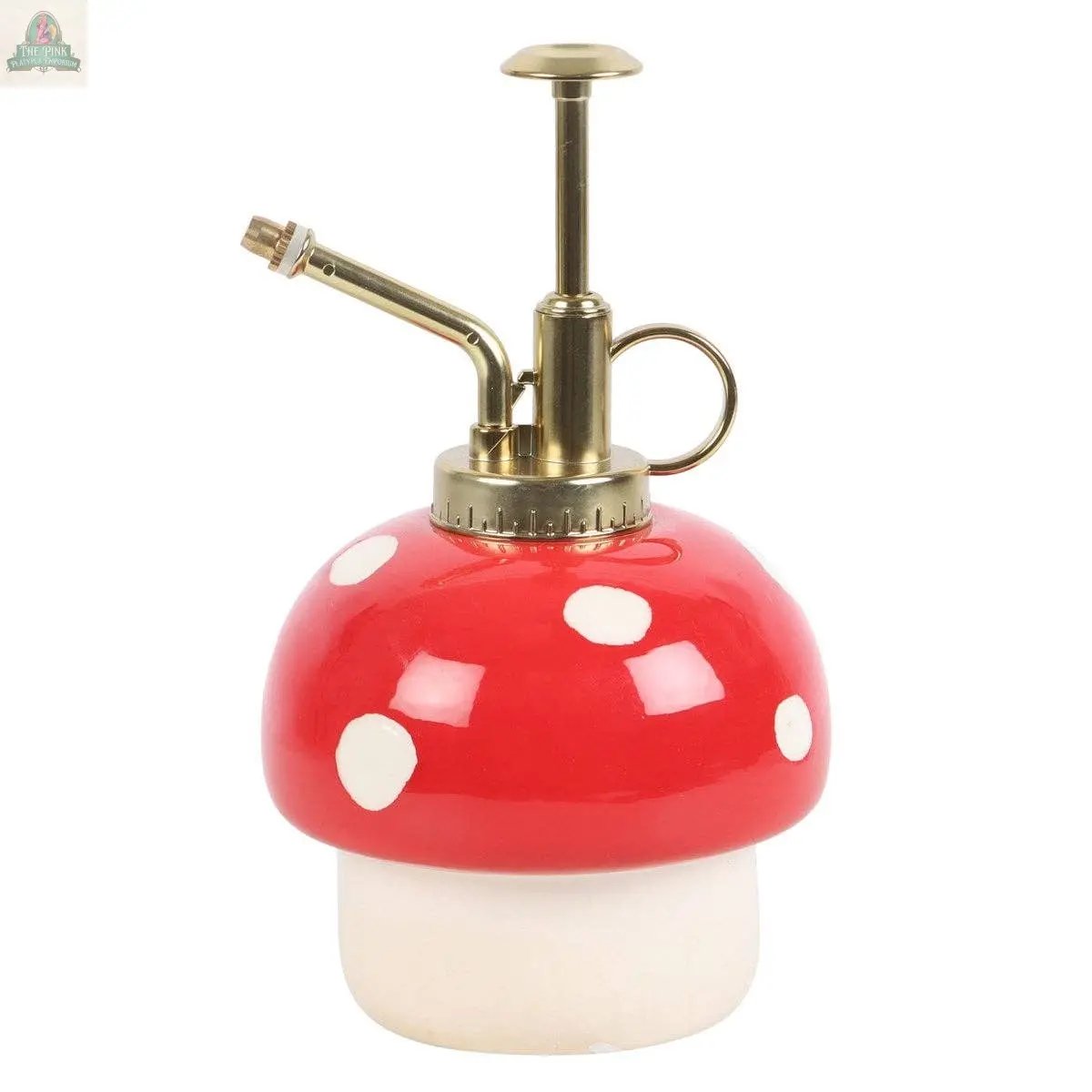 The Mushroom Shaped Plant Mister features a red and white ceramic base with a brass nozzle, adding charming cottagecore and enchanted forest vibes to your plant care routine.