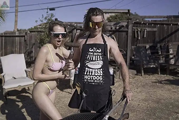 NOWHERE AMERICA - 'FITNESS HOTDOG' - Funny BBQ Apron - Gag Pink Platypus Emporium