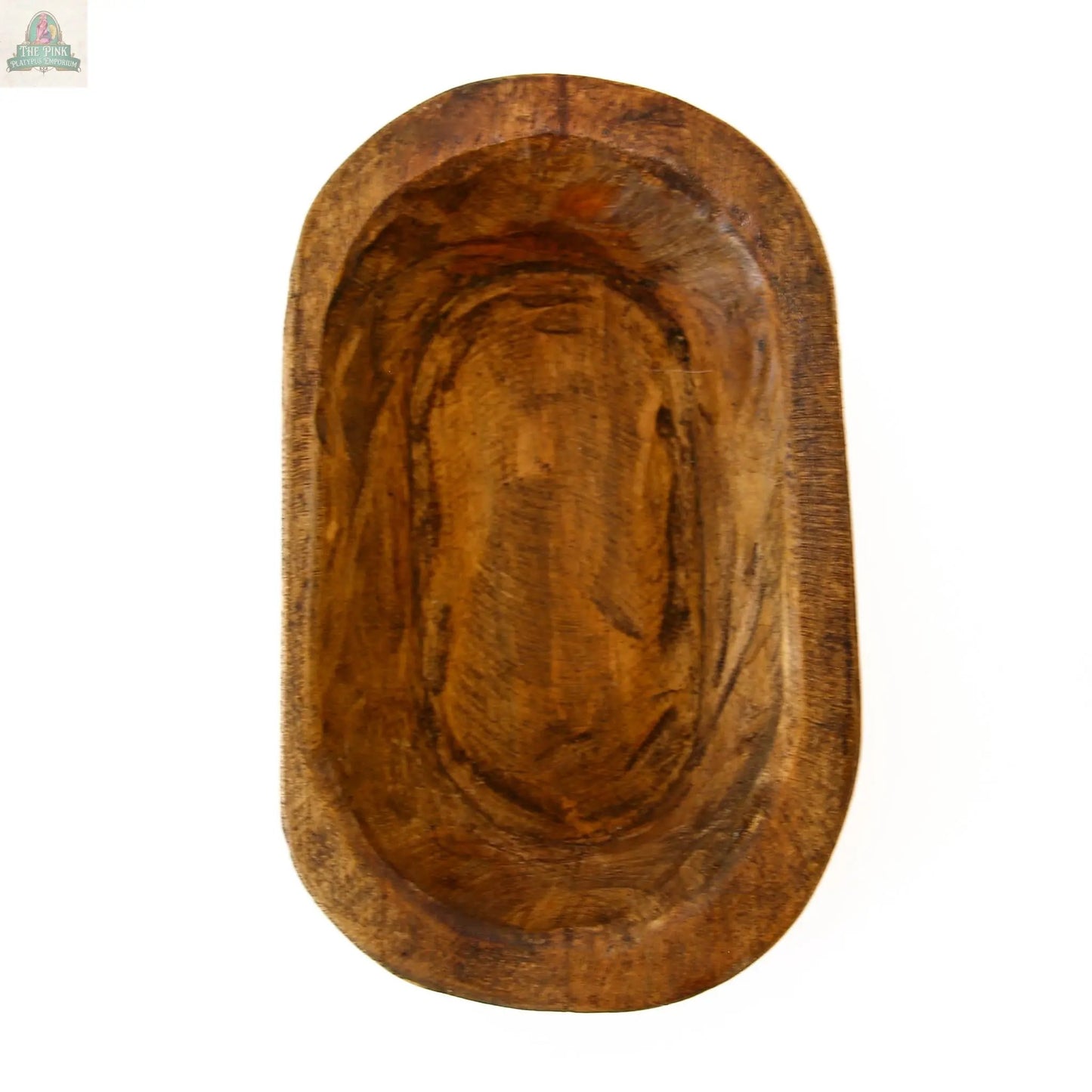 The Petite Wood Bowl (9-10"), handmade in Mexico, features a smooth carved interior and textured edges in a natural finish (10x6x3), displayed against a white background.