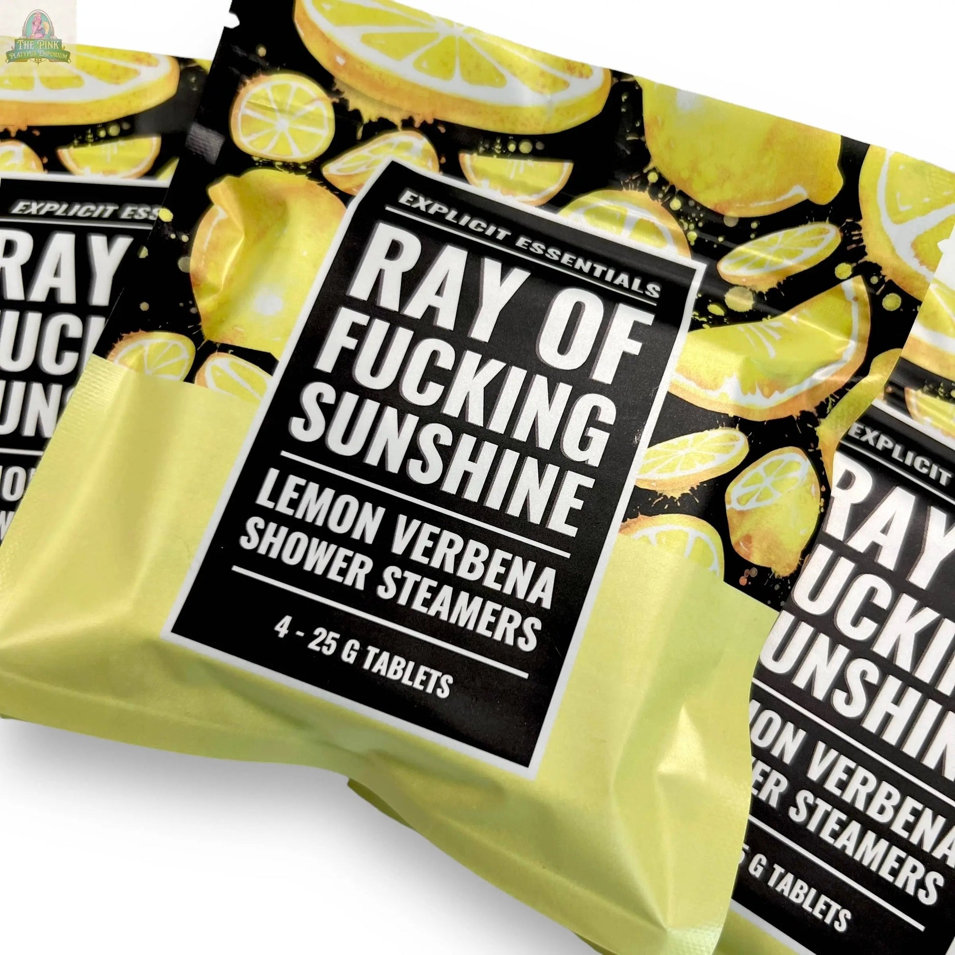 A pack of four 25g Ray of F&cking Sunshine Shower Steamers by Explicit Essentials, infused with essential oils and decorated with lemon slices.