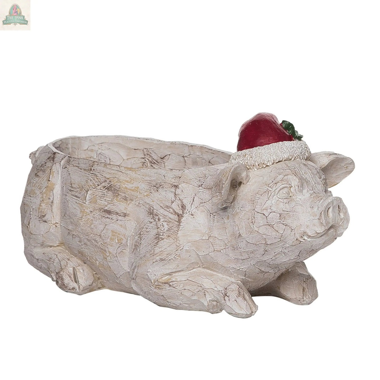 The Resin 10.5 in. Cream Christmas Pig/Cow Container features a pig in a red Santa hat with holly, lying down with a planter opening on its back—perfect as a festive resin home accent for your holiday décor.