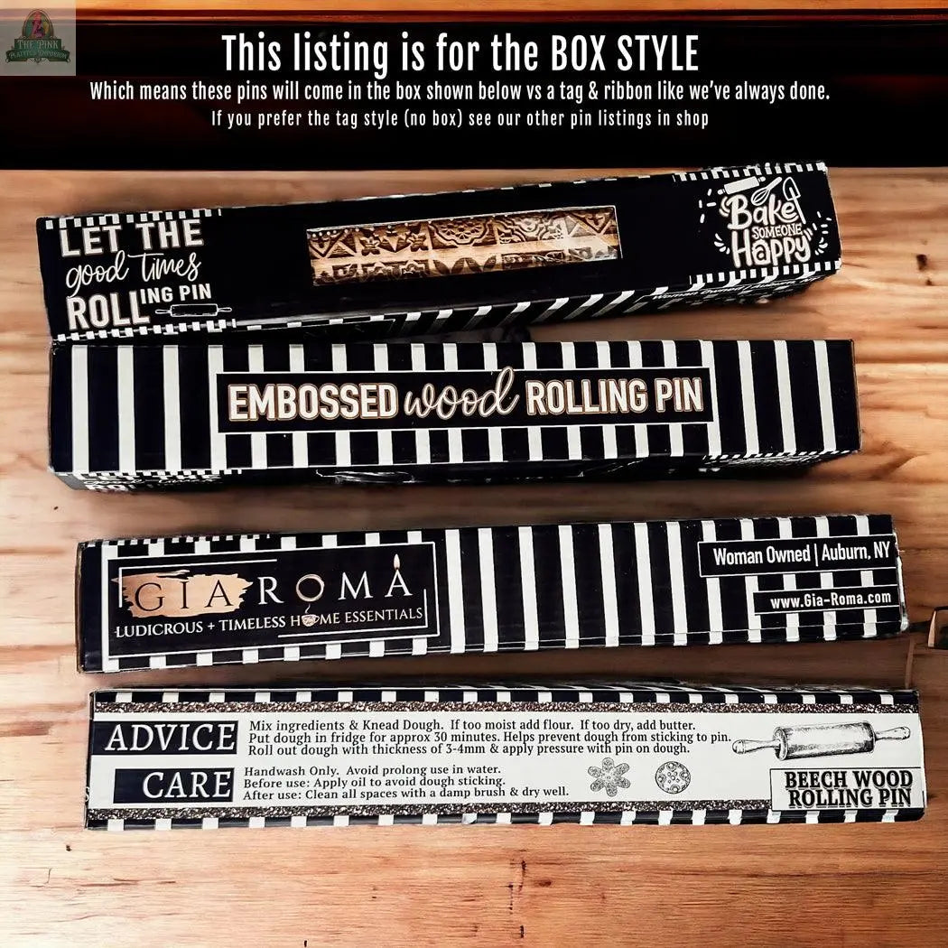 Four boxed Rolling Pins - Box Style are shown on a wooden surface. Each box has black-and-white designs with text, patterns, and care tips—great for unique baking gifts. The listing is specifically for the box style.