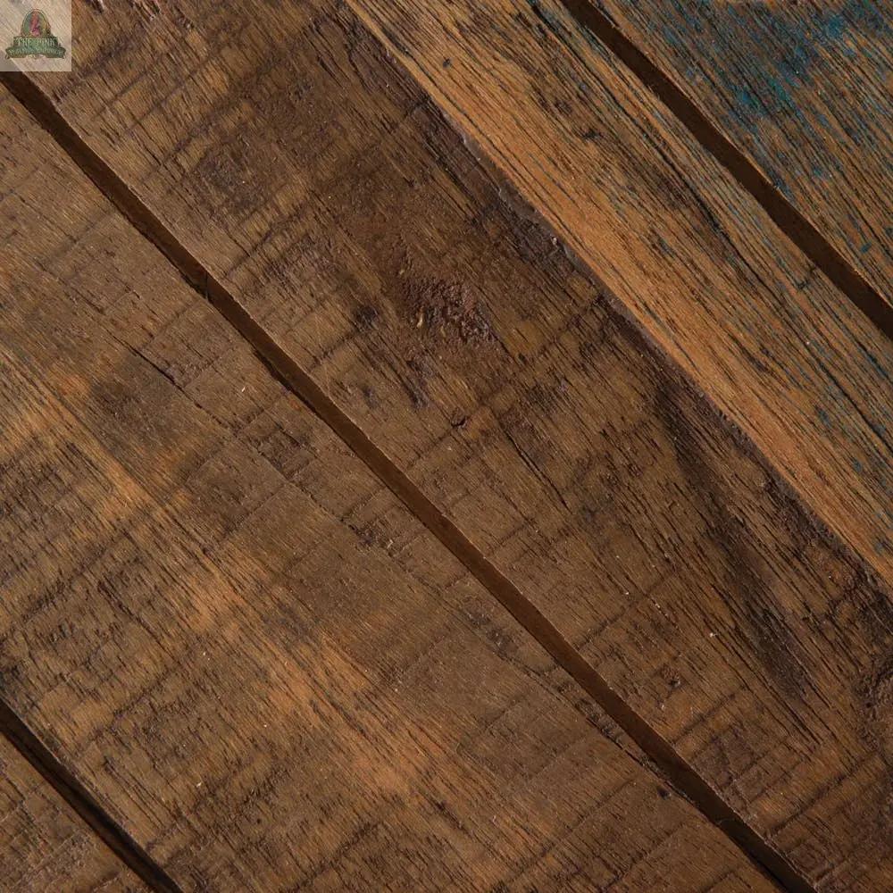 Close-up of two Salwood Christmas Stars crafted from real wood planks with a natural brown finish, visible grain, and rough texture—arranged diagonally with slight gaps and dark marks for a rustic Christmas decor touch.